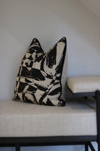 Linen and Black Bench