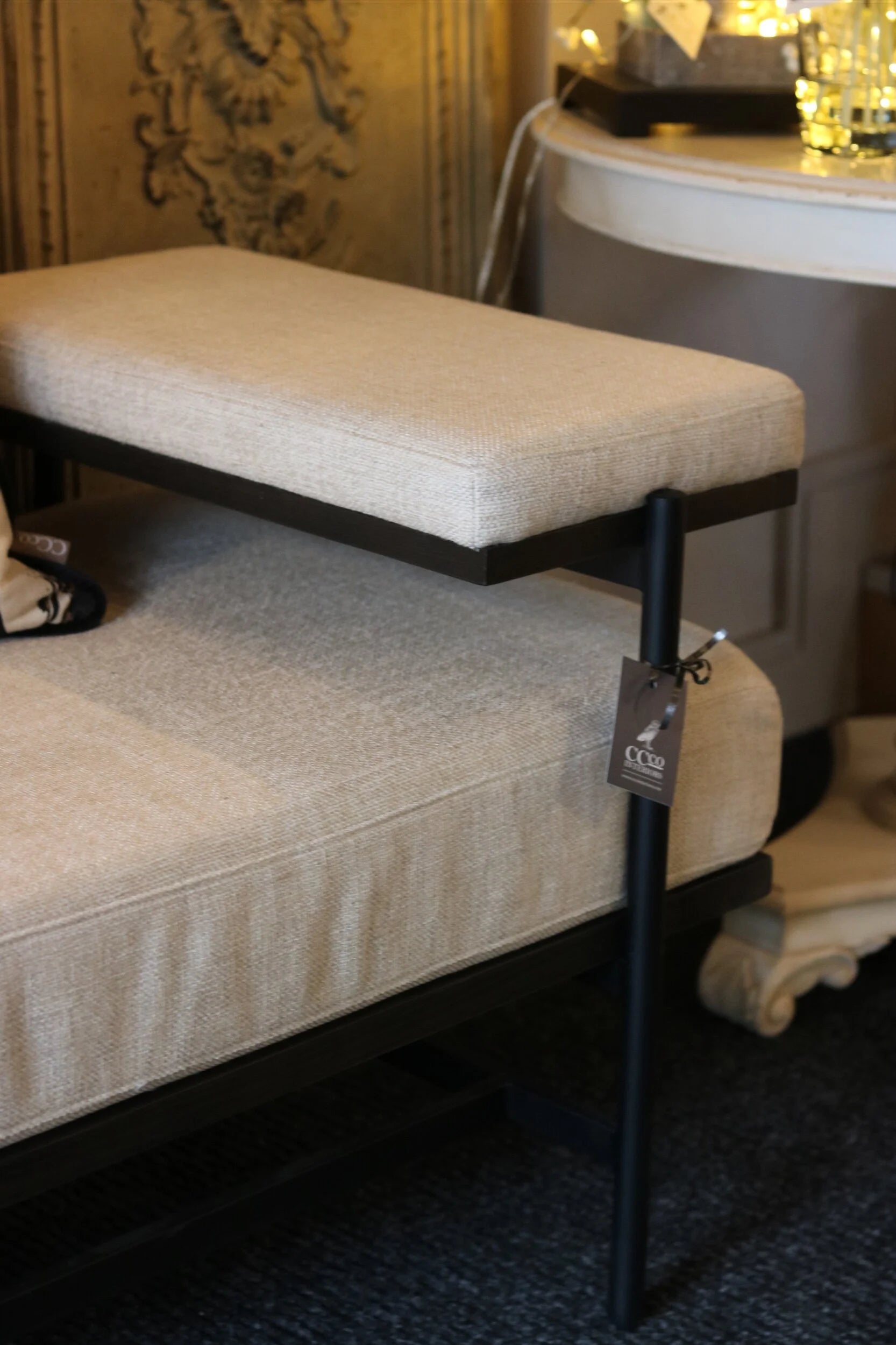 Linen and Black Bench