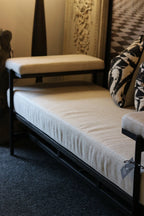 Linen and Black Bench