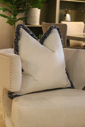 White Flat Velvet Cushion with Andrew Martin Navy ‘Moscow Mule’ Fringe