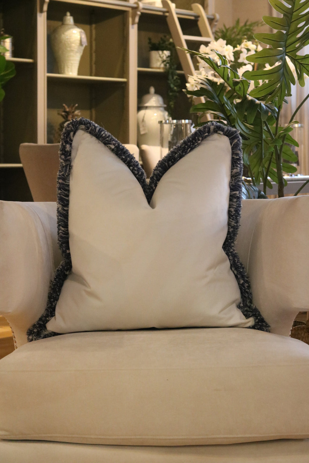 White Flat Velvet Cushion with Andrew Martin Navy ‘Moscow Mule’ Fringe