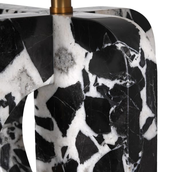 Black and white marble vase with a gold base